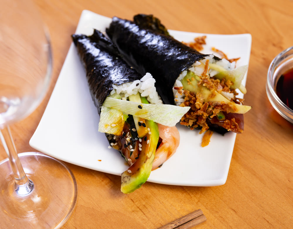 Maguro temaki - these are rolls made of rice wrapped in nori seaweed, with tuna, lettuce, cucumber, avocado, onions