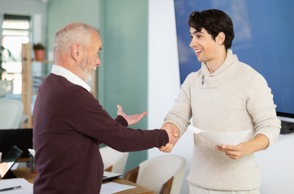 Confirmation of successful business negotiations with kind handshake, businessperson shaking hands and closing deal