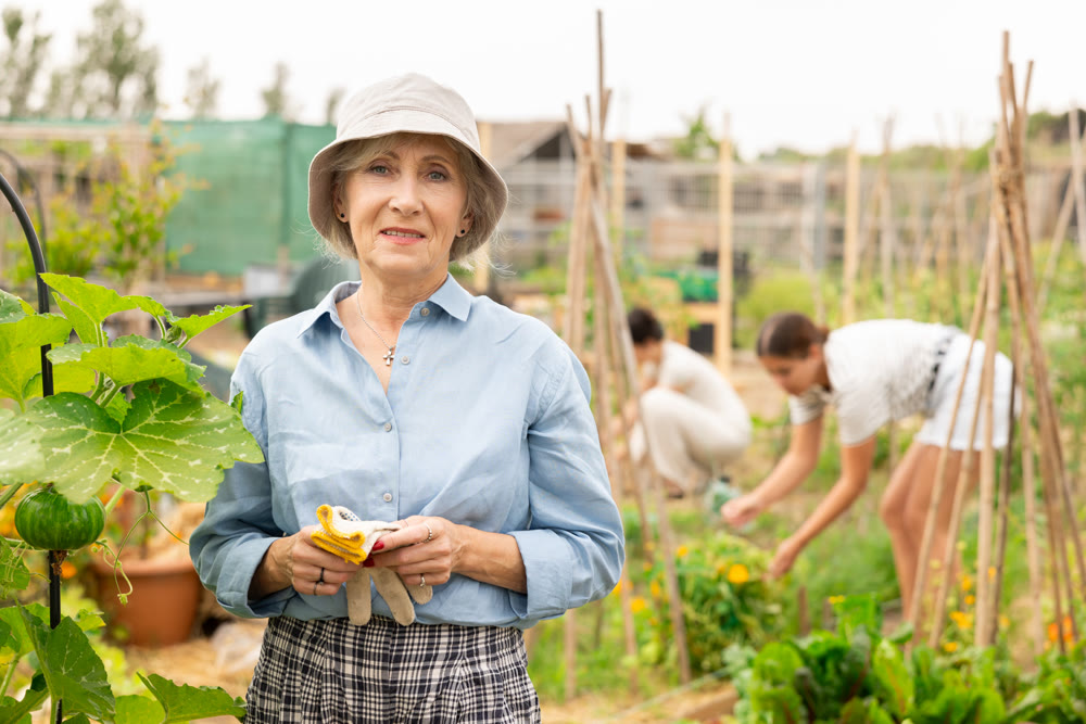 Mature woman at kitchen-garden