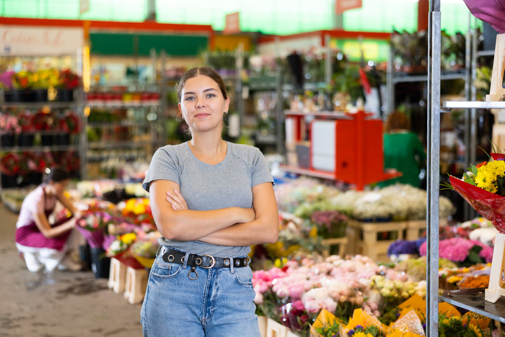 Portrait of young woman at flower market