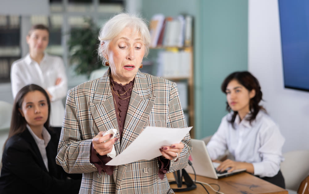 Upset mature female employee leaving office
