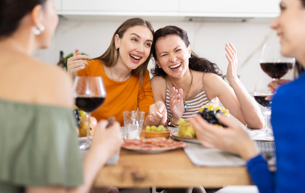 Female friends having fun at intimate house party