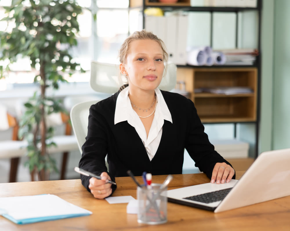 Young woman working on laptop in office
