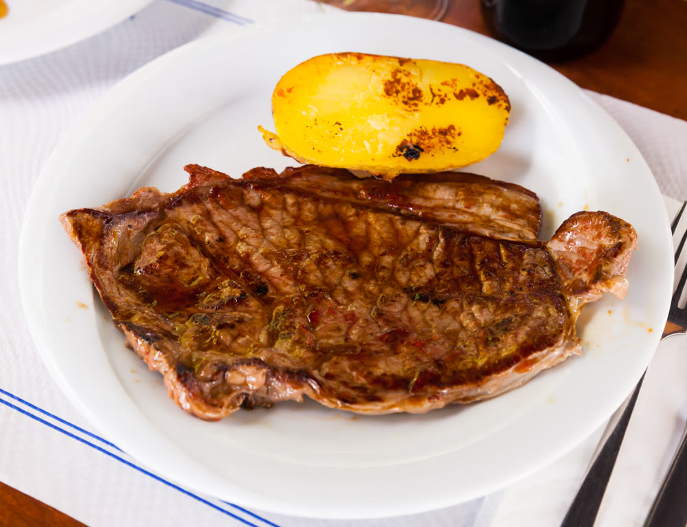 Appetizing beef steak with potatoes