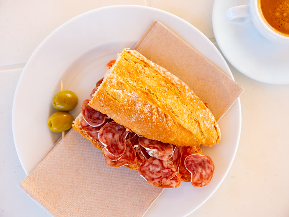 Sandwich with delicious delicaty dried sausage Fuet