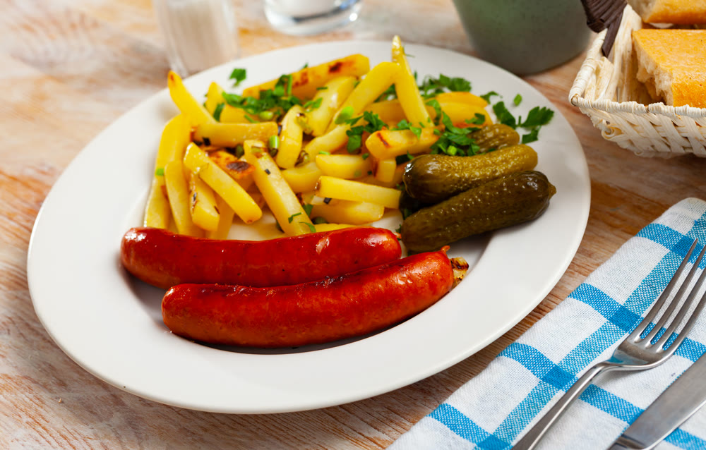 Sausages with potatoes and pickled cucumbers