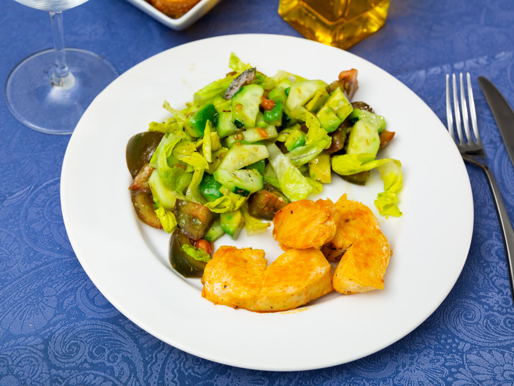 Popular dish of chicken breast with vegetable salad