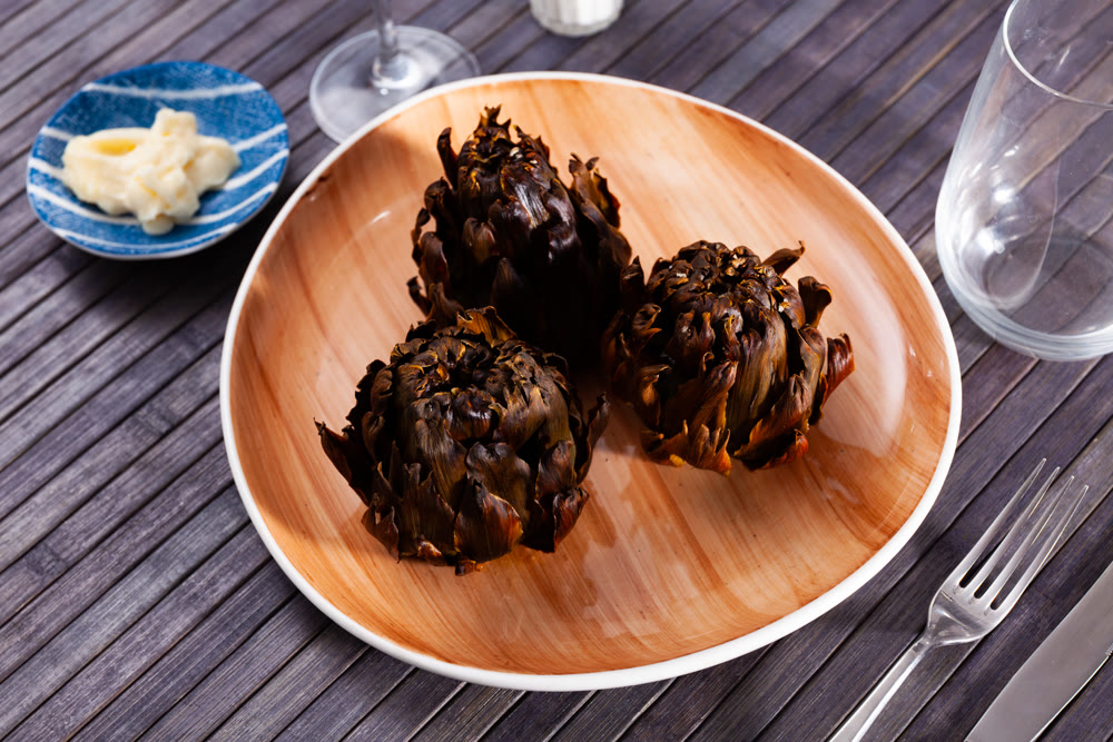 Delicious roasted artichokes served with garlic aioli sauce