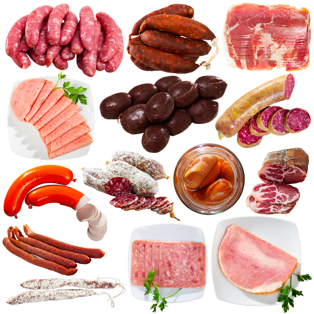 Collection of various sausages and ham on white