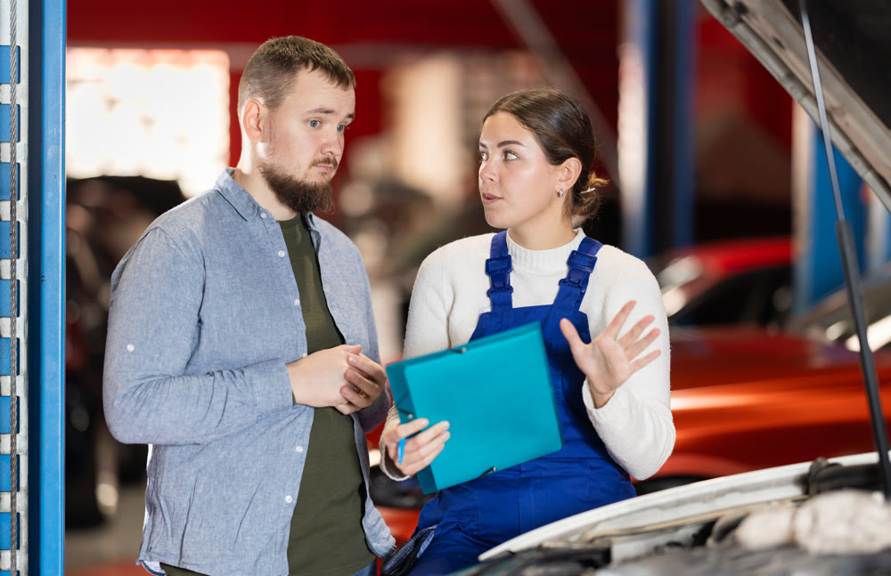 man with a manager in a car service