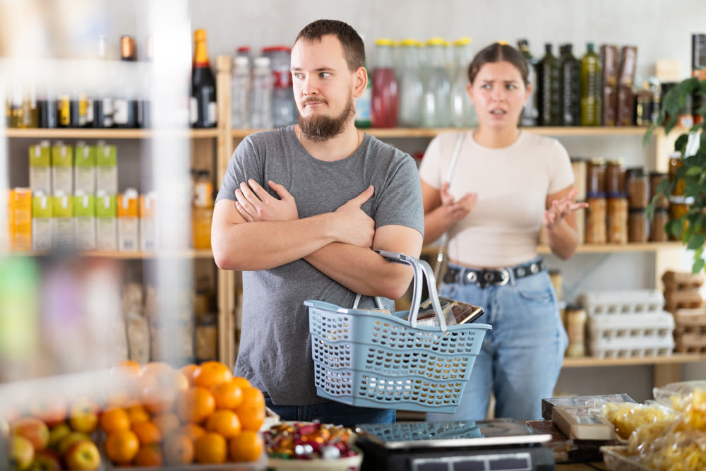 Family quarrel between a husband and wife in grocery supermarket