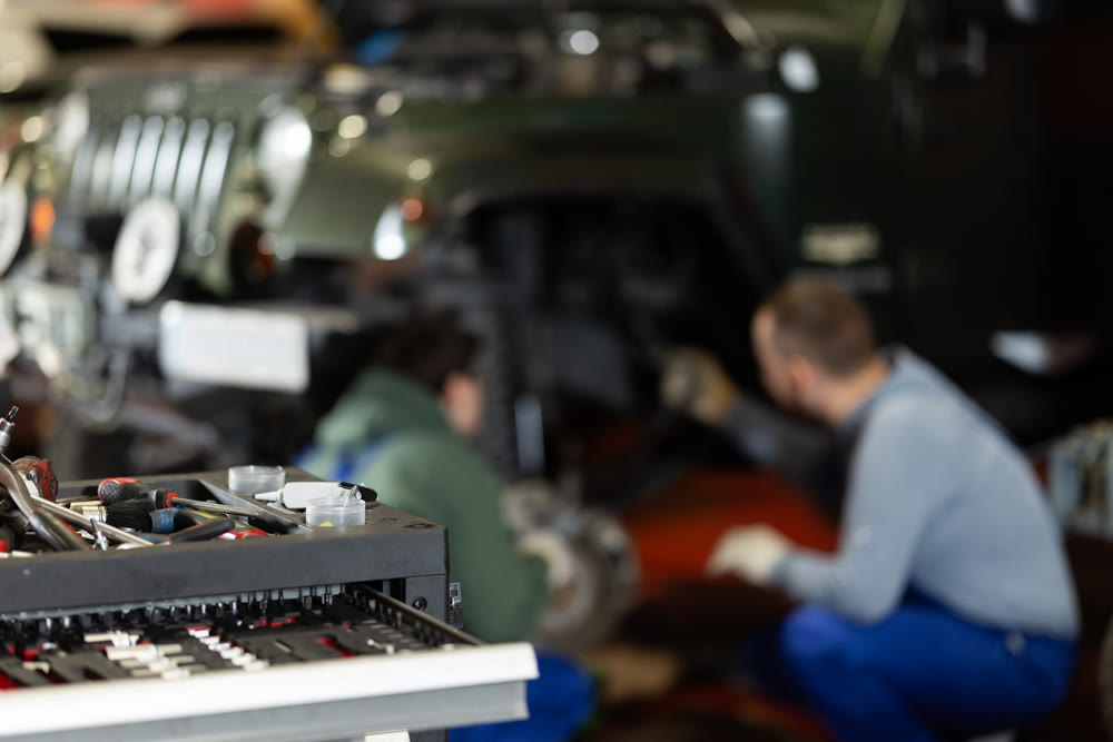 Car repair tools against the background of mechanics