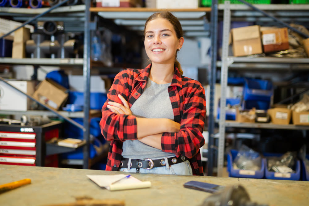 Portrait of positive girl warehouse worker