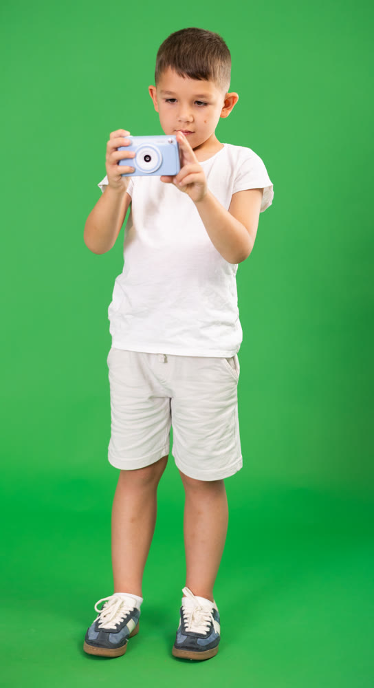 Boy takes pictures by camera