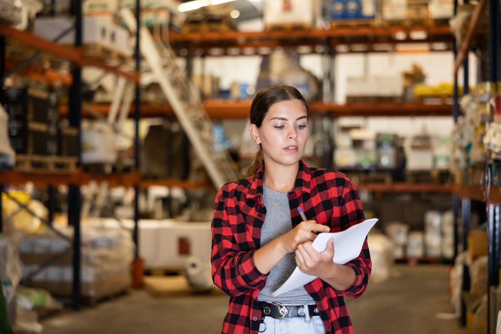 Portrait of focused young girl checking order list