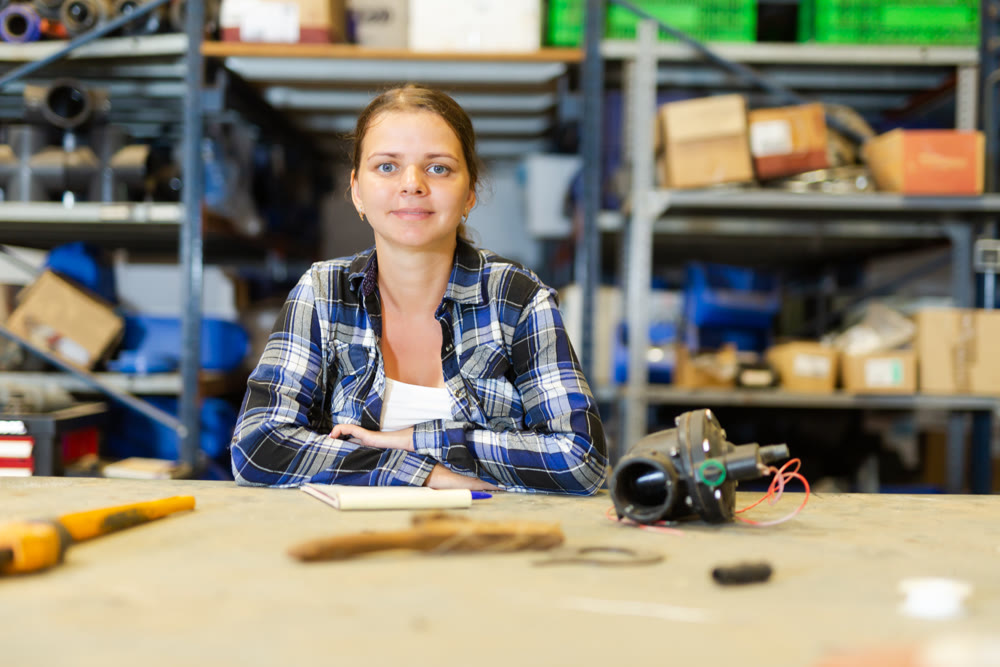 Portrait of positive woman warehouse worker