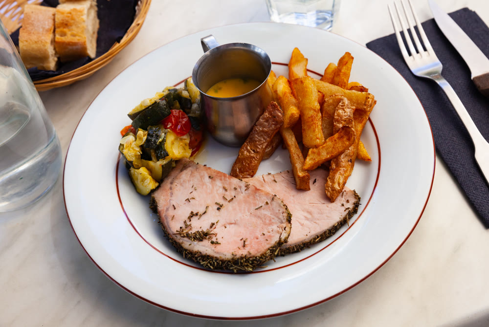 Pork loin with french fries and vegetables