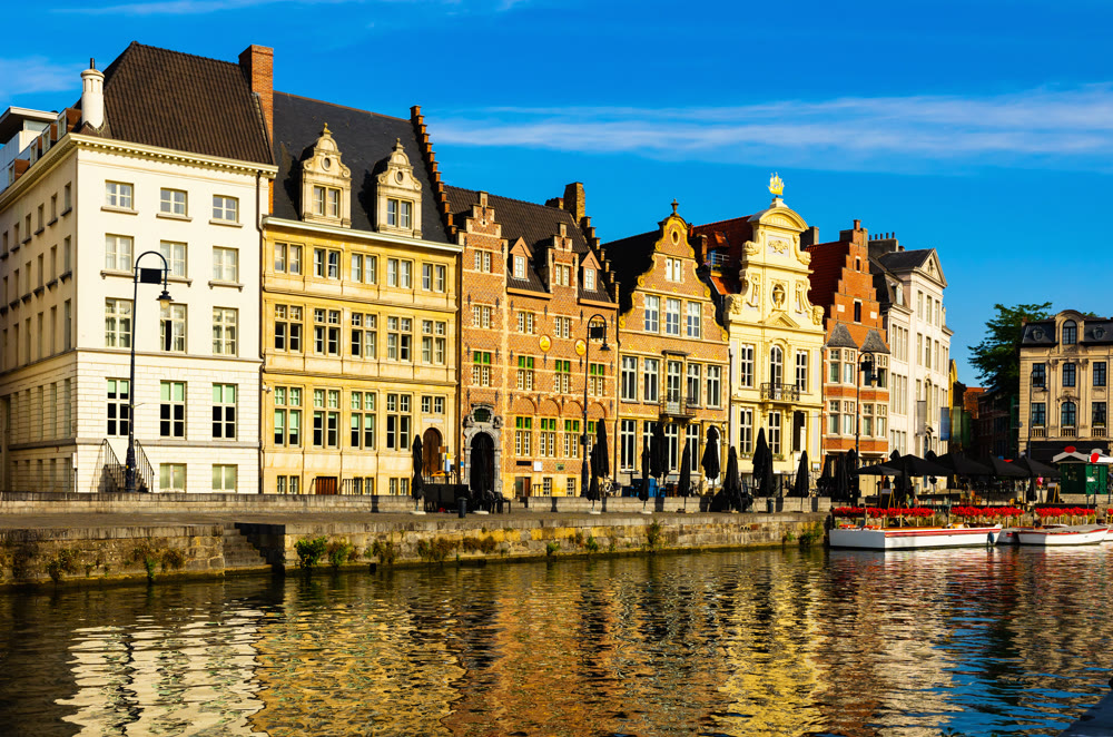 Typical residential buildings in historic center of Ghent along Leie river