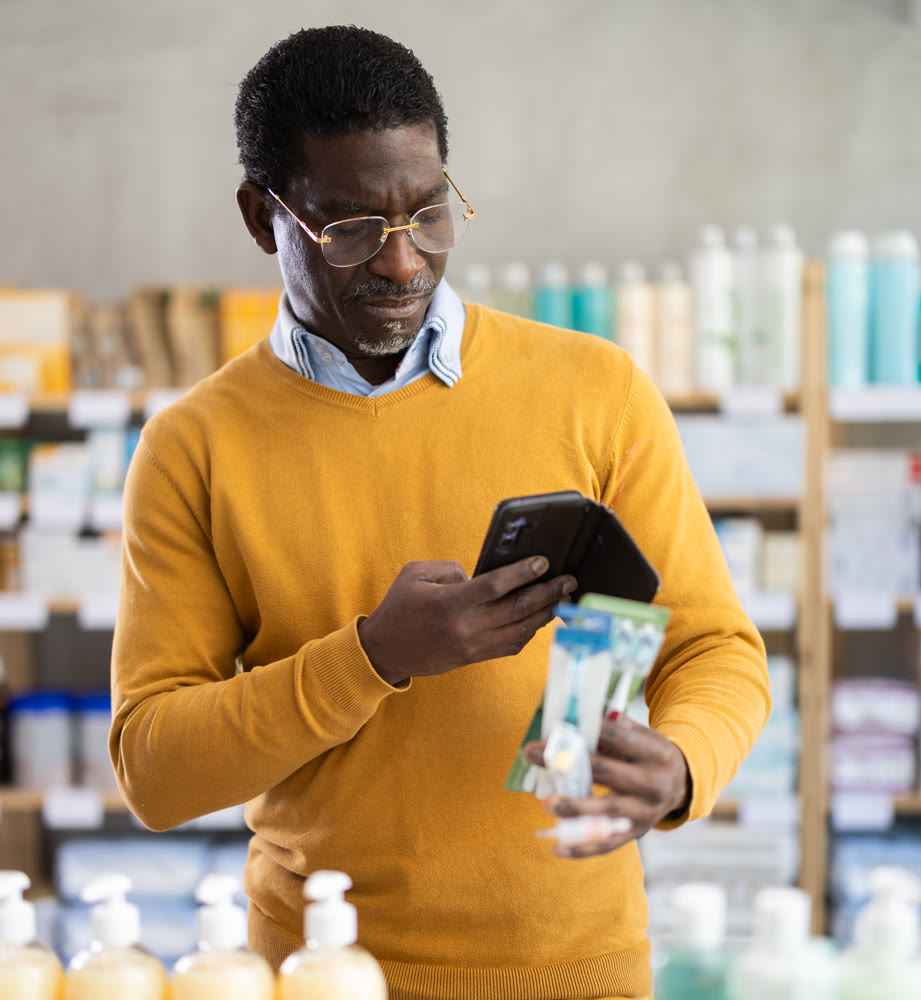 Adult man scanning qr code of toothbrush