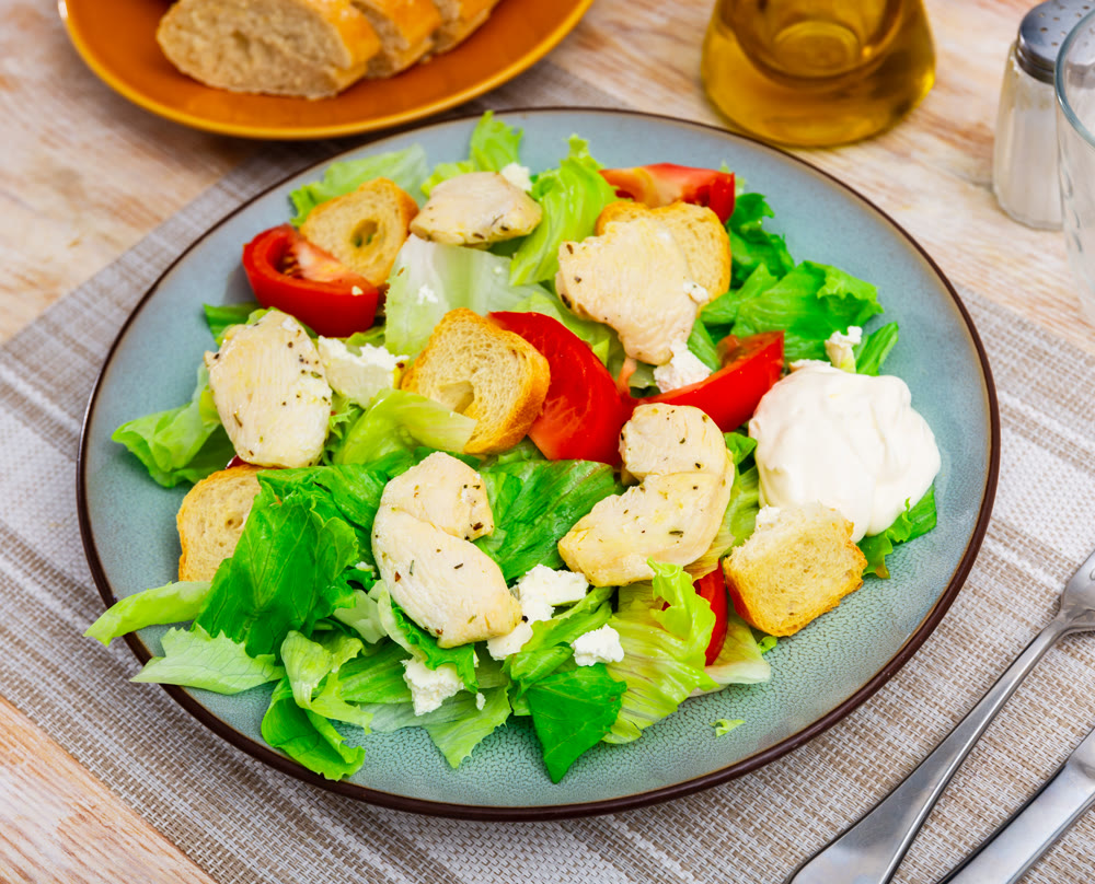 Caesar salad with grilled chicken and croutons