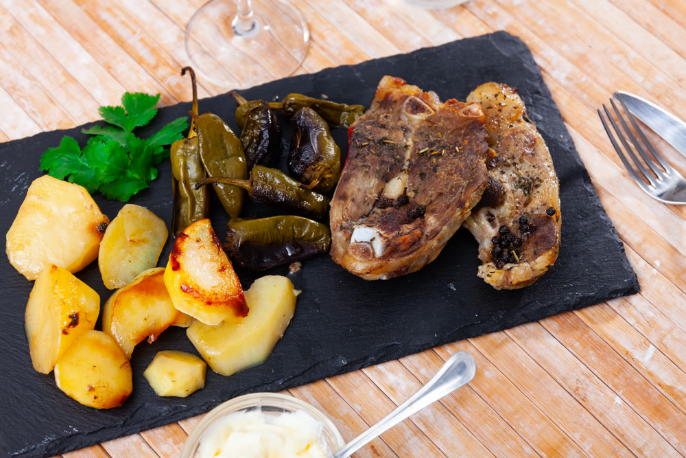 Dish of lamb leg with potatoes and pepper