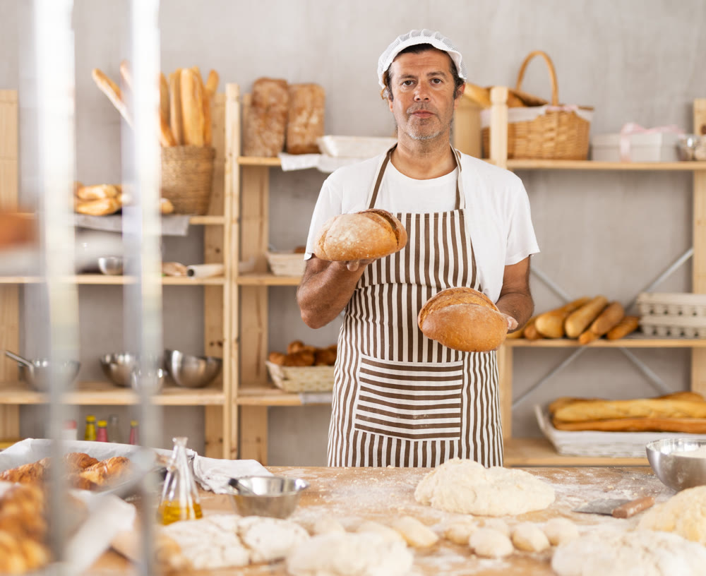 Adult male baker with homemade bread