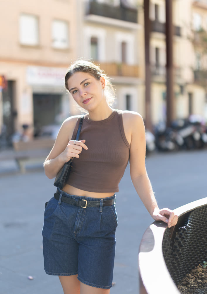 Woman posing during city street walk