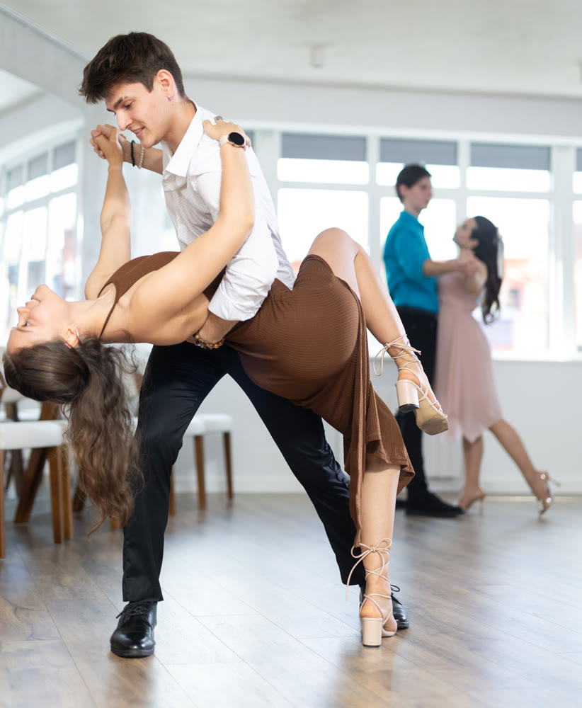 Tango performed by young couple in choreographic studio