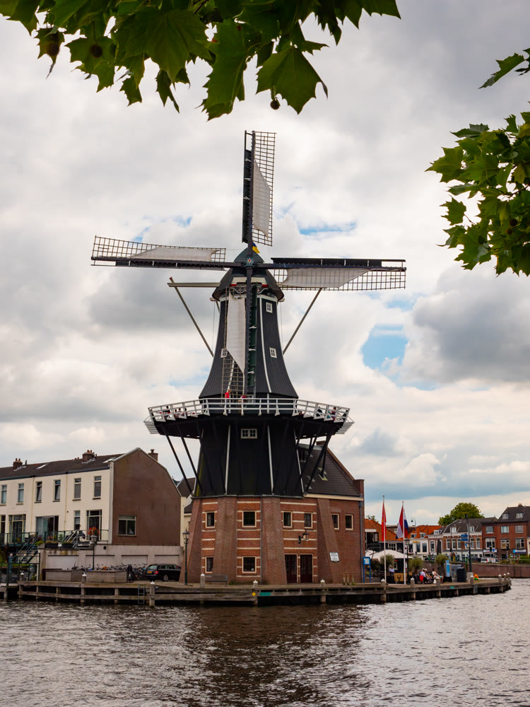North Holland, Haarlem, Spaarne river canal and de Adriaan windmill