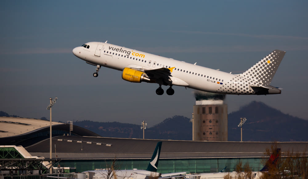 Barcelona, El Prat - February 02, 2020: Airline Vueling plane takes off from the runway at Barcelona El Prat airport. Board number EC-LLM