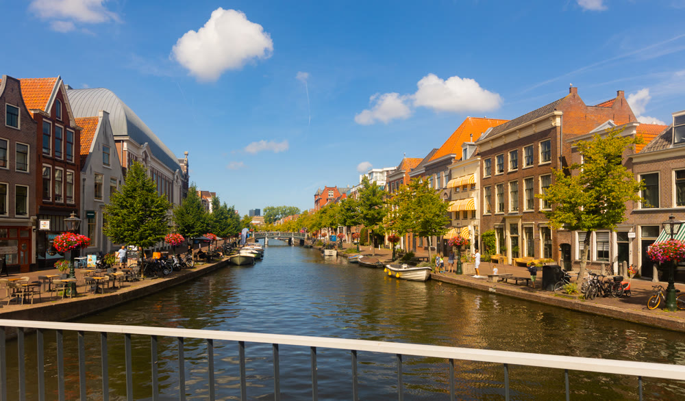 Impressive view of canal and buildings of beautiful old city of Leiden