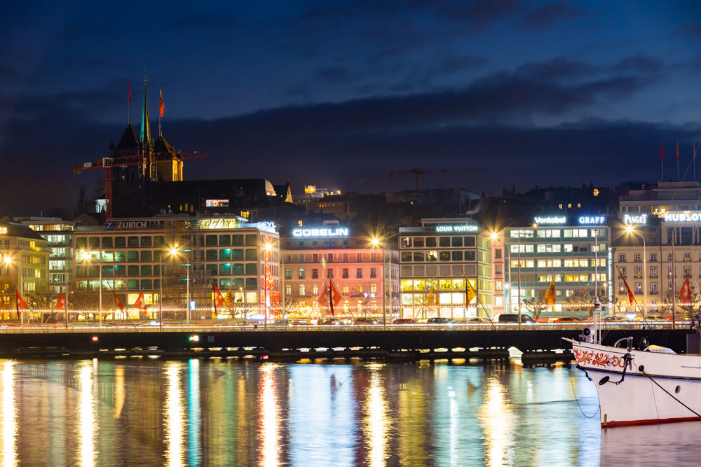 GENEVA, SWITZERLAND - DECEMBER 30, 2021: Evening view of the city Mont Blanc embankment