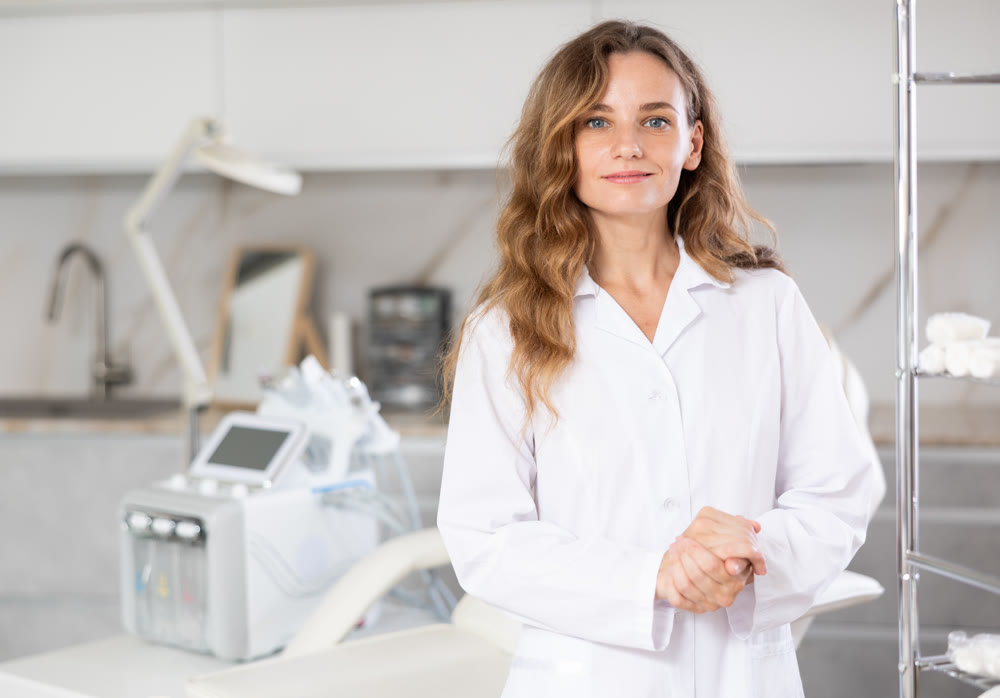 Young female doctor posing in medical room