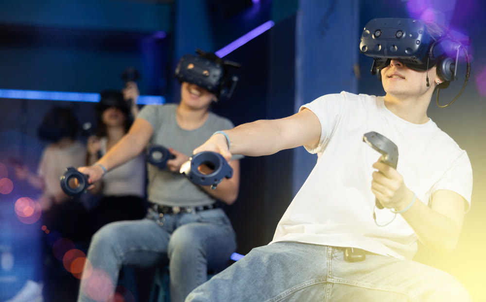 Man in virtual reality glasses controls superhero with joystick in exciting action game simulator