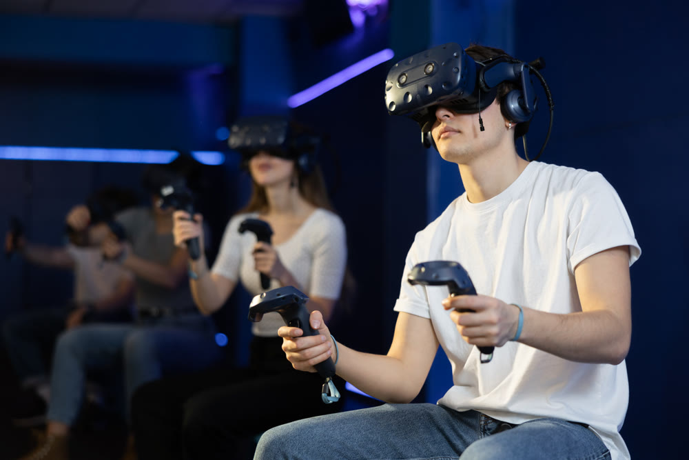 Man in virtual reality glasses controls superhero with joystick in exciting action game simulator