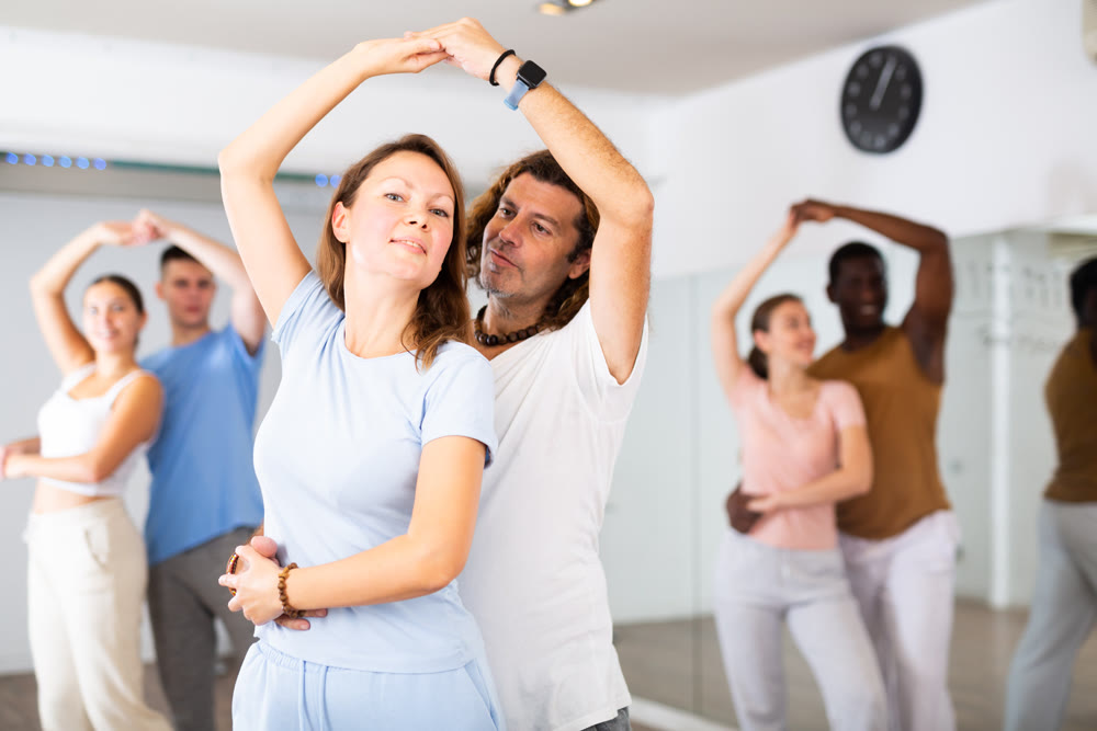 Adult man and adult woman dancing pair dance