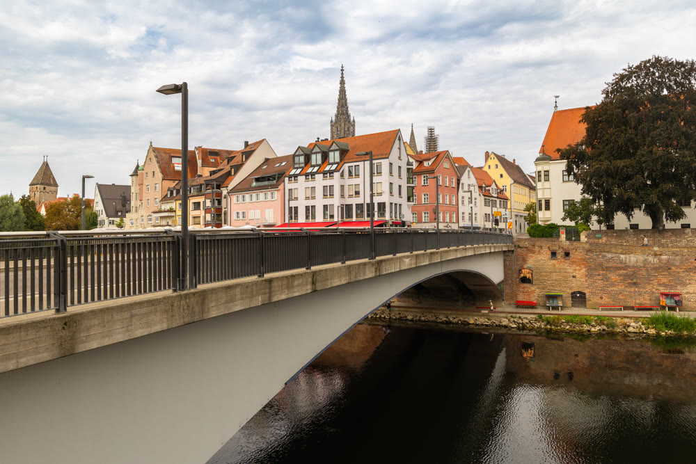 Picturesque riverbank featuring traditional German houses along Danube river