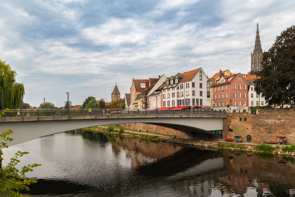 Picturesque riverbank featuring traditional German houses along Danube river