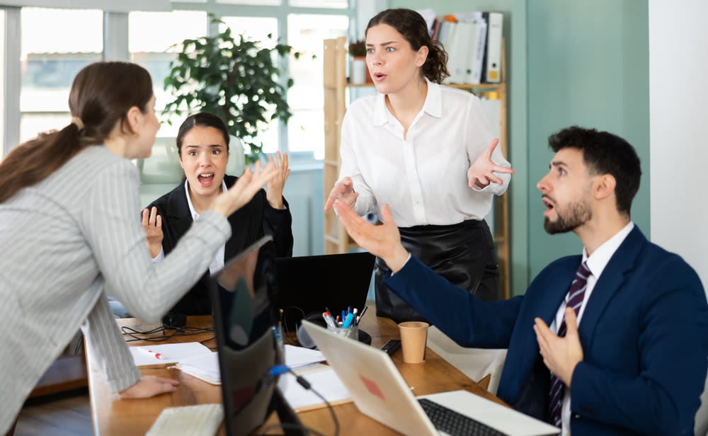 Team of employees got into an argument during an office meeting