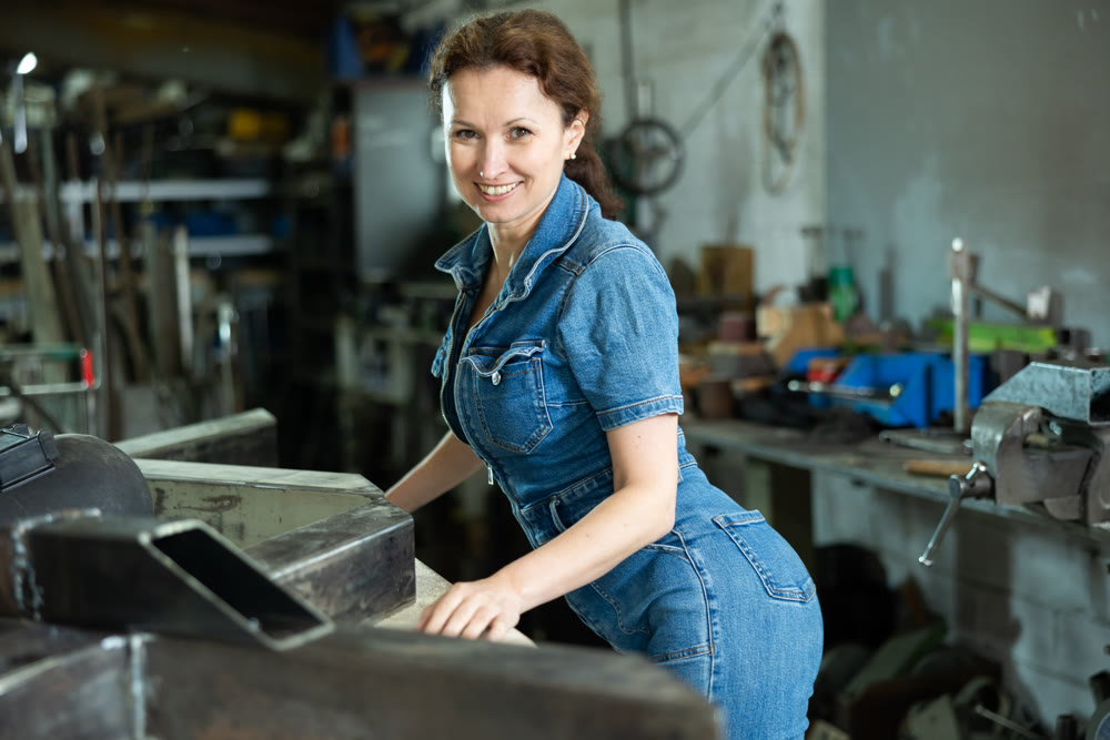 Adult woman posing in oak workshop