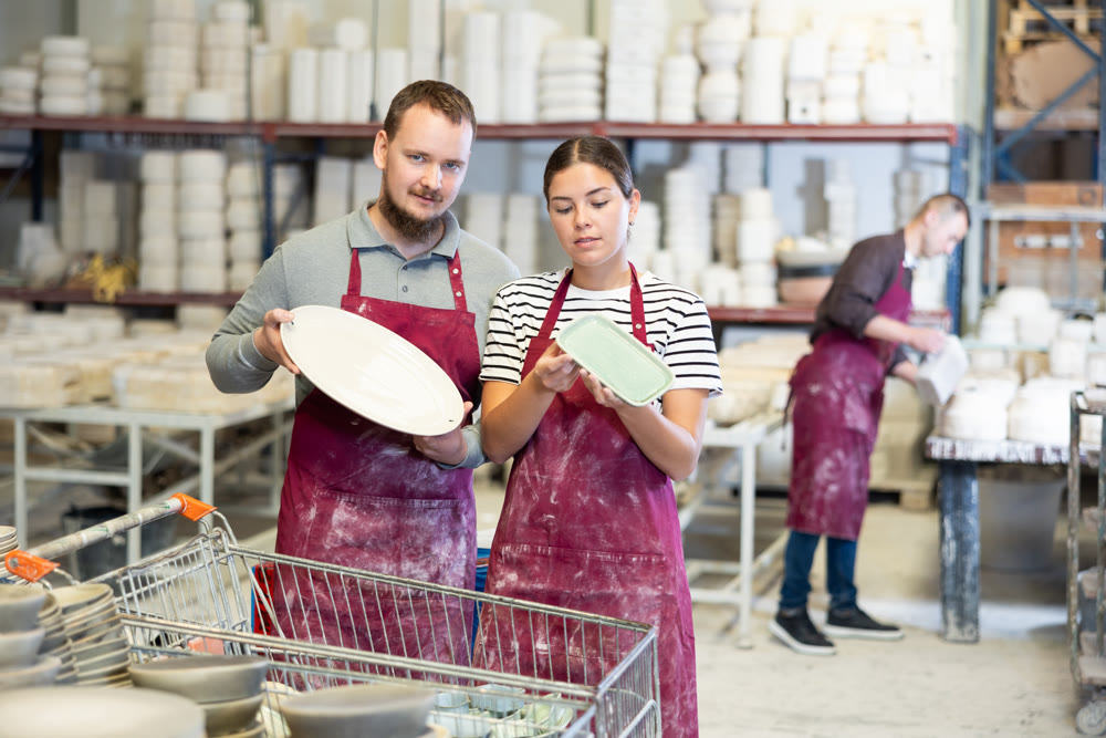 Man and woman talking about finished dishes