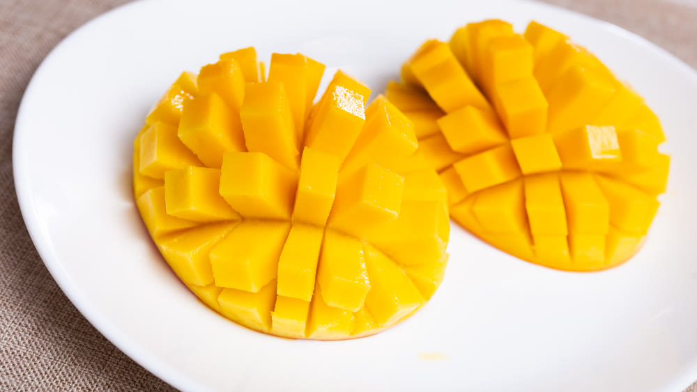 Pieces of ripe mango served on platter