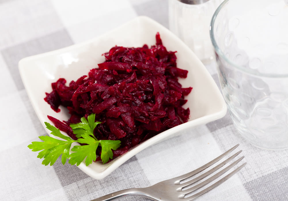 Salad of shredded boiled beets served with fresh greens