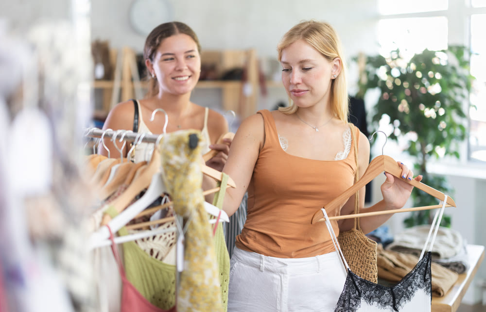 Two women shopping in a clothing store