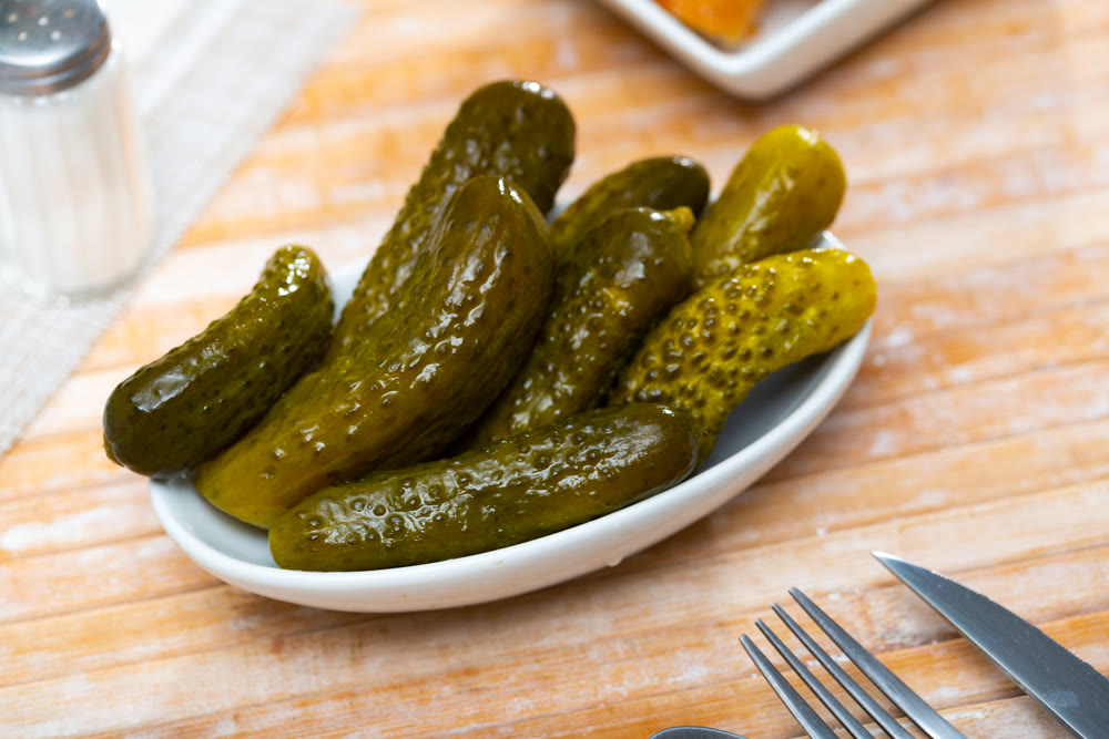 Pickled cucumbers on a ceramic plate