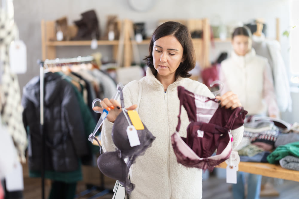 Adult woman chooses underwear in clothing store
