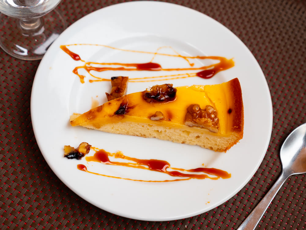 Appetizing piece of walnut pie on platter