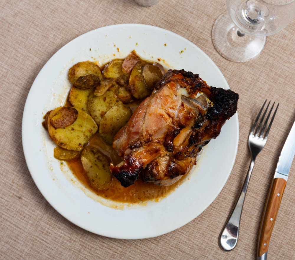 Appetizing pork knuckle served on platter