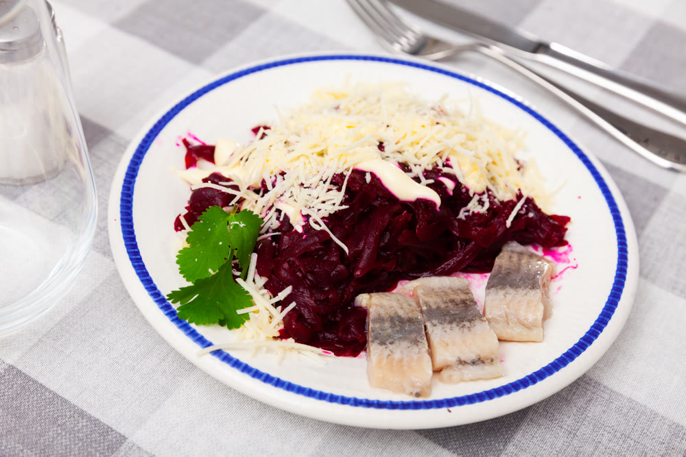 Appetizing beetroot with cheese and herring