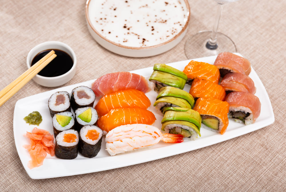 On table there portion set with maki - uramaki and nigiri